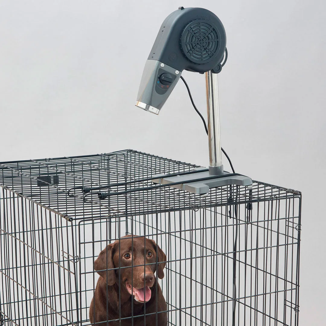 Rover's Edge Buddy low velocity tabletop dryer clamped to a wire kennel above a dog